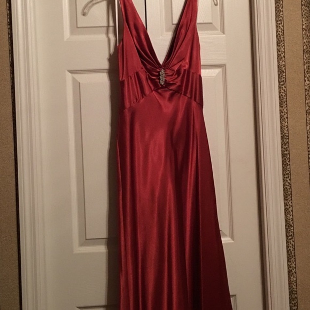 Betsy and Adam designer rust colored prom dress.